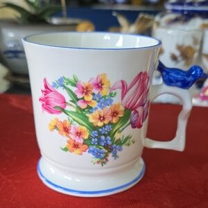 Crownford Floral Mug with Blue Accents and Blue Bird sitting on the Handle.